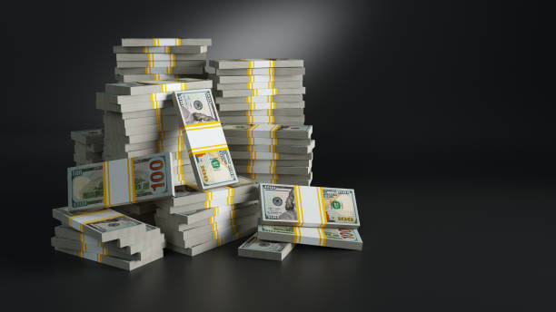 istock Batches with dollars. Heaps of paper money 1055084696