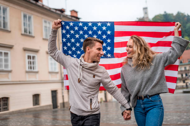 istock Cheerful couple with American flag 1055086072