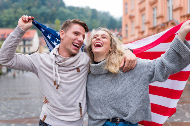 istock Cheerful couple with American flag 1055086094