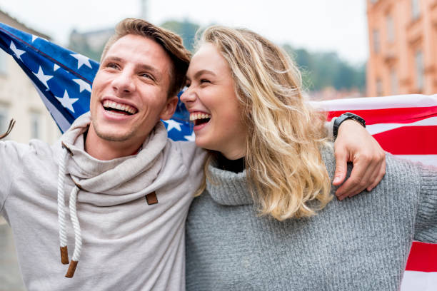 istock Cheerful couple with American flag 1055086124