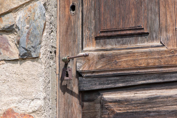 istock A lock on a brown wooden door 1055087398