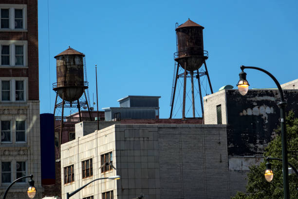 istock Architectural image of buildings and water tanks 1055087850