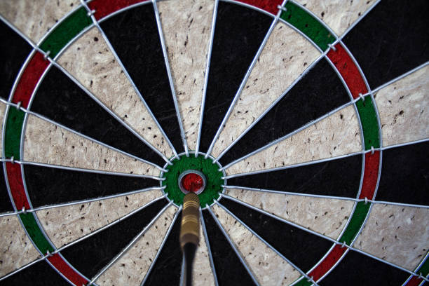 istock a darts on the wall with dart hit the mark 1055088668