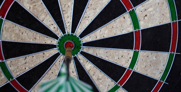 istock a darts on the wall with dart hit the mark 1055090852