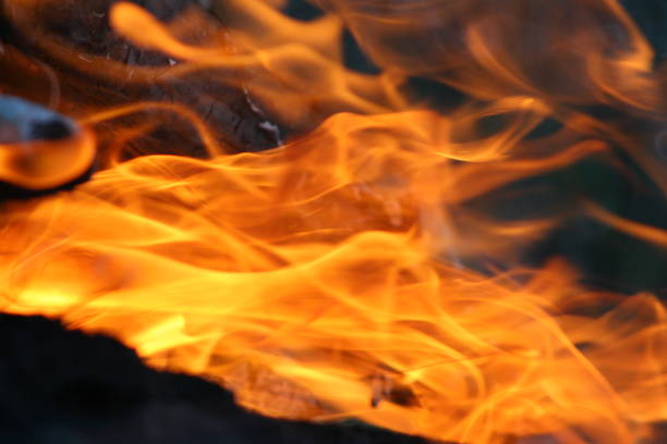 istock Burning and smoking wood logs 1055091148