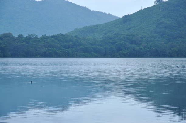 istock landscape of mountain with mist floating in lake 1055091636
