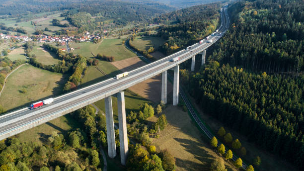 istock Highway bridge through forestland - aerial view 1055091984
