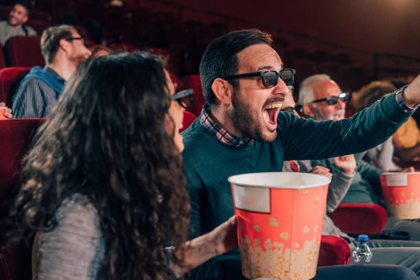 istock Excited couple wearing 3D glasses 1055092092