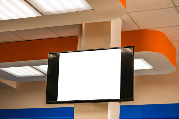 istock Blank white TV screen on indoor wall, 1055093488