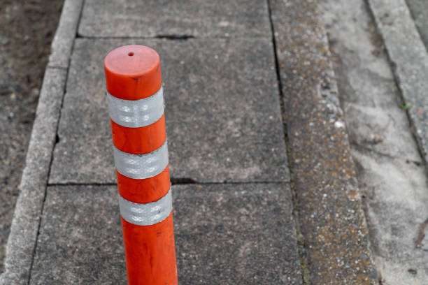 istock Orange pole on the road / Image of the city 1055094730