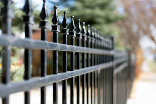 Black iron fence outside stock photo