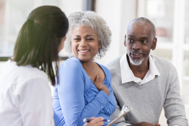 istock Senior couple talk with doctor about test results 1055095184