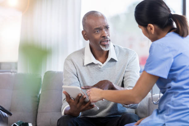 istock Upset senior man talks with doctor 1055095236