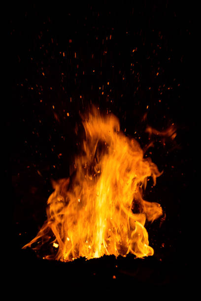 istock Sparks bounce off from a bonfire at night 1055101268
