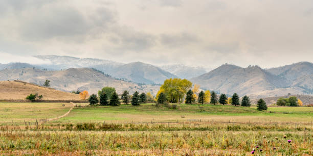istock Snow clouds over foothills and farmland 1055101920