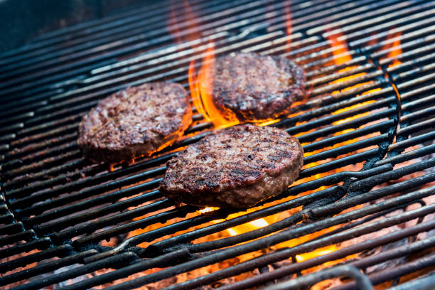 istock Hamburgers are cooking on the grill 1055102696