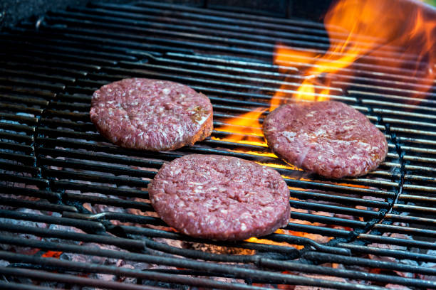 istock Hamburgers are cooking on the grill 1055104332