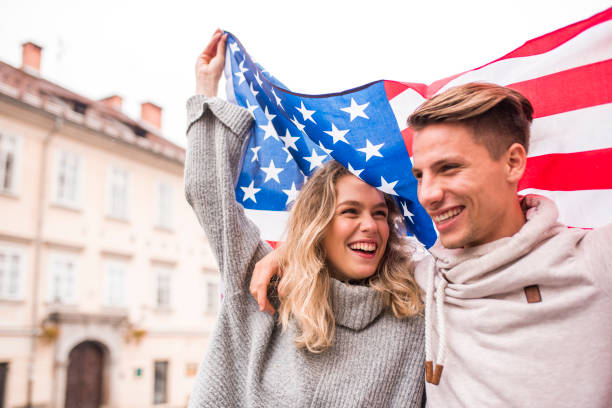 istock Cheerful couple with American flag 1055104542