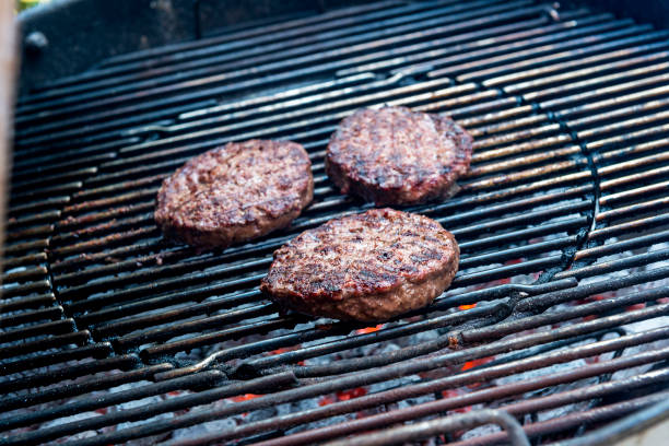 istock Hamburgers are cooking on the grill 1055104568