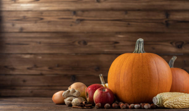 istock Autumn harvest on wooden table 1055110414