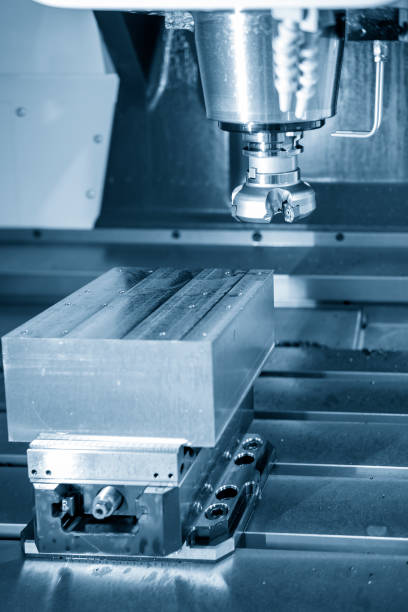 istock The  CNC milling machine cutting the mold part with the face-mill tool. 1055113522