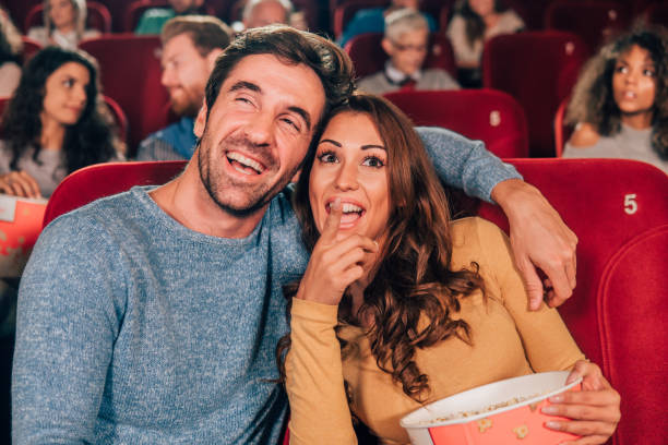 istock Romantic couple hugging at cinema 1055116030