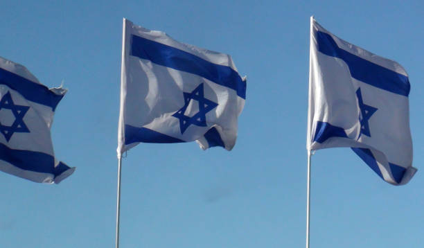 istock Three Israeli Flag Waving Scene In Jerusalem Israel 1055120264