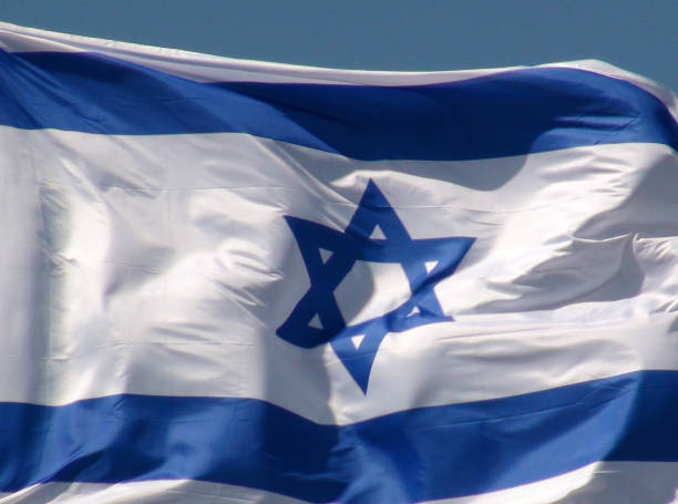 istock Israel Flag Close Up Scene In Israel 1055120528