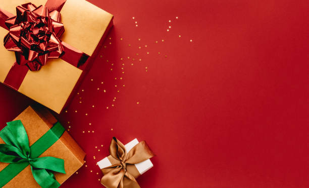 Heap of gift boxes and stars confetti with copy space