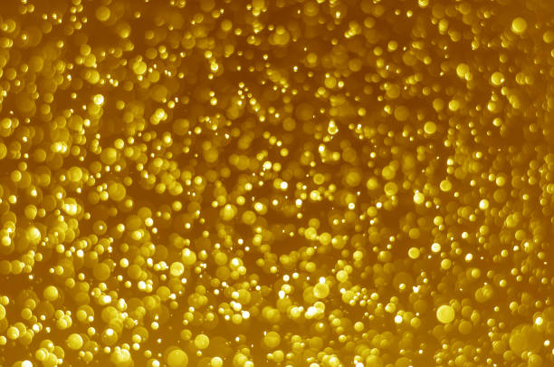 istock abstract yellow gold bokeh glitter sparkle background. background for template web advertising design brand, backdrop, party, new year christmas celebration etc. 1055126834