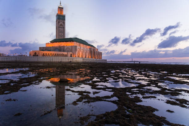 istock View Of Lighthouse By Sea Against Sky During Sunset 1055126924