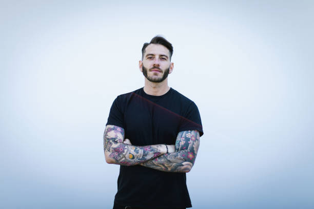 istock Portrait of tattooed young man 1055128120