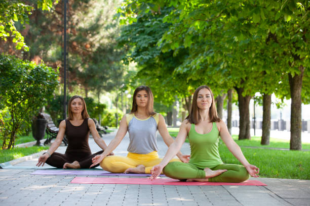 istock Practicing of yoga outdoors. 1055130382