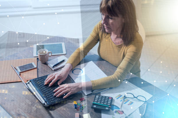 istock Businesswoman working on laptop, light effect 1055130688