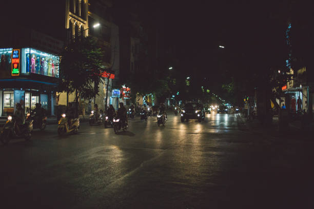 istock Illuminated City Street At Night 1055136130