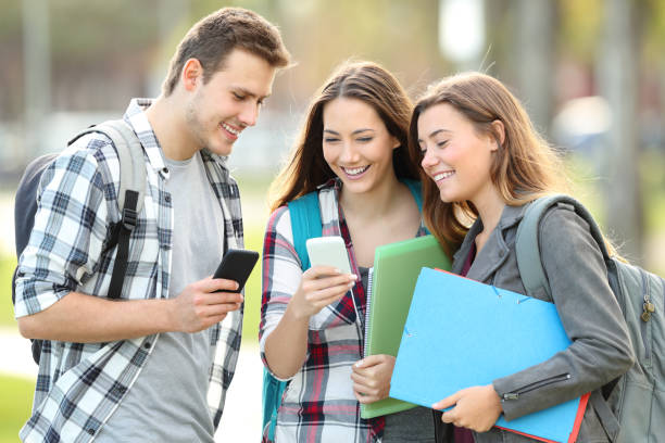 istock Students watching media in their smart phones 1055139868