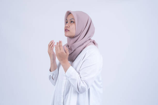 istock Praying Asian Muslim Woman 1055140294