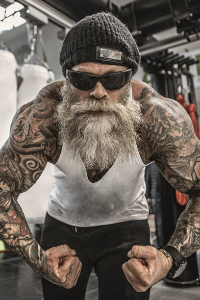 istock Tattooed Senior Man During Workout 1055140522