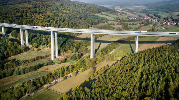 istock Highway bridge through forestland - aerial view 1055150588