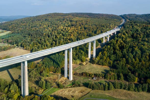 istock Highway bridge through forestland - aerial view 1055150592