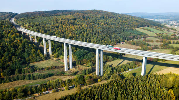 istock Highway bridge through forestland - aerial view 1055150642