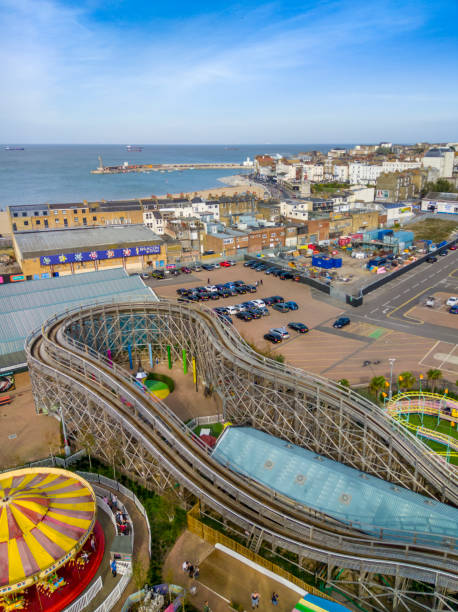 Margate town and seafront from above Margate, UK. 13 October 2018. A view over the rides of Dreamland fair and Margate town and seafront on a sunny day. People walking around the rides and in the town. thanet photos stock pictures, royalty-free photos & images