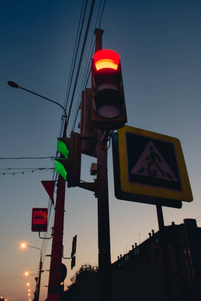 istock Red color on the traffic light with a beautiful blue sky in background 1055153382