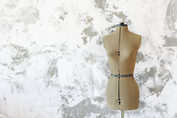 istock Mannequin over the grey wall in the room 1055158184