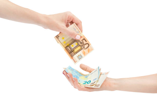 istock Woman's hand giving euro bill. Isolated on white. 1055160766