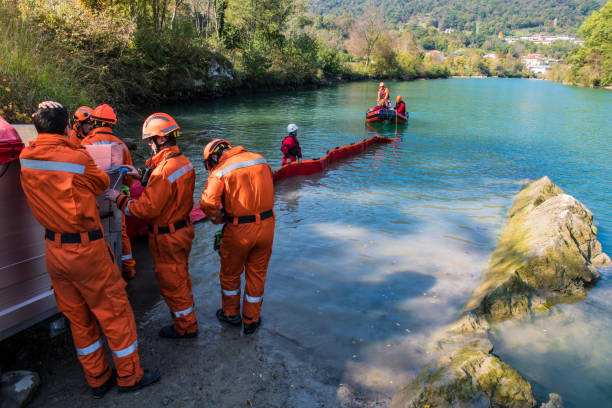 istock Dam construction on the river - rescue operation with a boat, oil spill 1055162450
