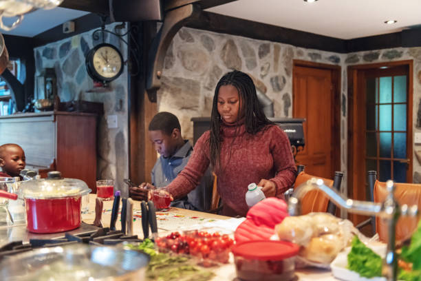 istock African-American preparing thanksgiving dinner 1055168984