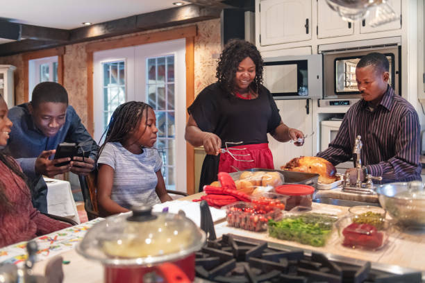 istock African-American preparing thanksgiving dinner 1055169212