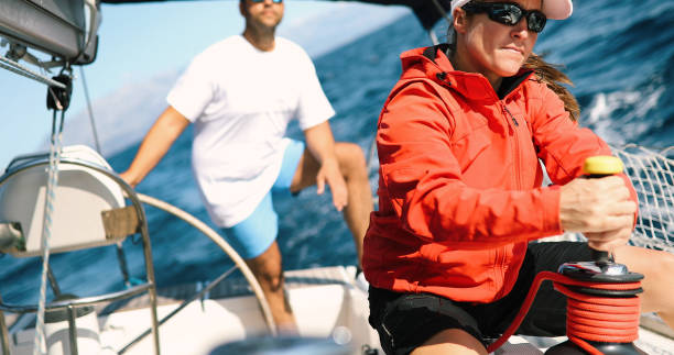 istock Couple sailing in sea at sunny day 1055169218