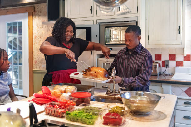 istock African-American preparing thanksgiving dinner 1055169260